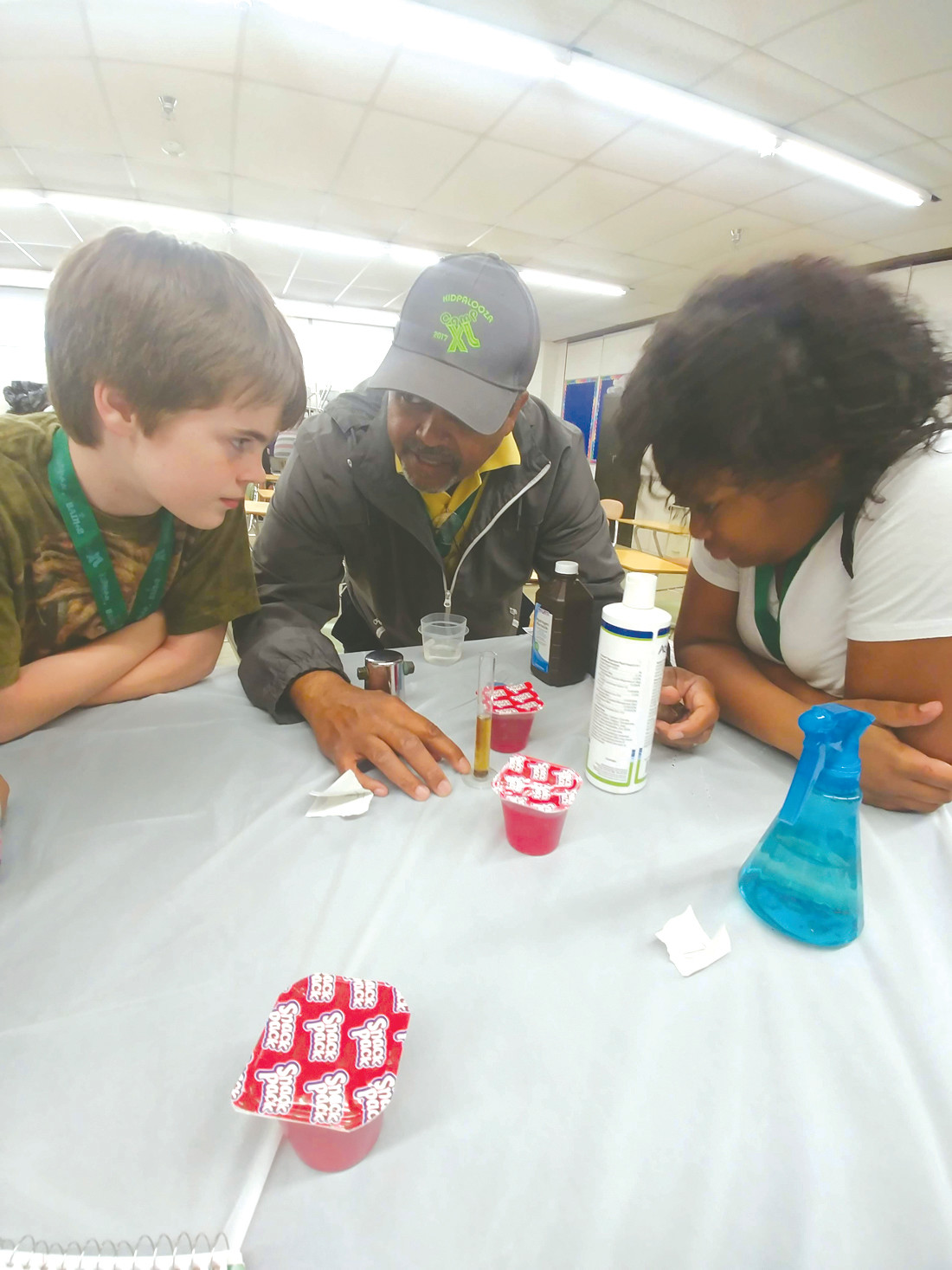 WILL IT WORK: Dr. Jesse Jordan and two of his students, Nyleiha McCants Snead and James Seal examine a solution being used in a jello experiment.